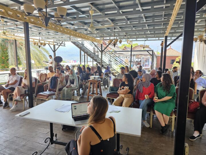 Climate Justice Camp: general view of the audience, with speaker Yasmina al Amine at the front. August 2023